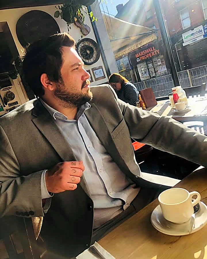 Jake Anthony, web design consultant, in a Liverpool café